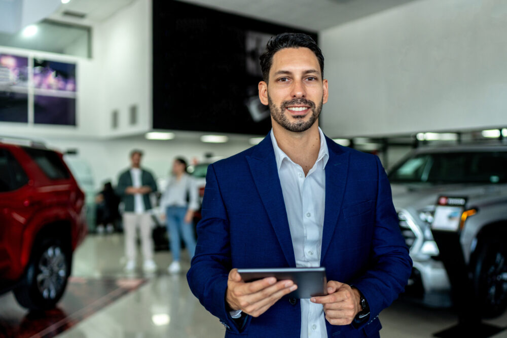 man in business casual shirt smiling